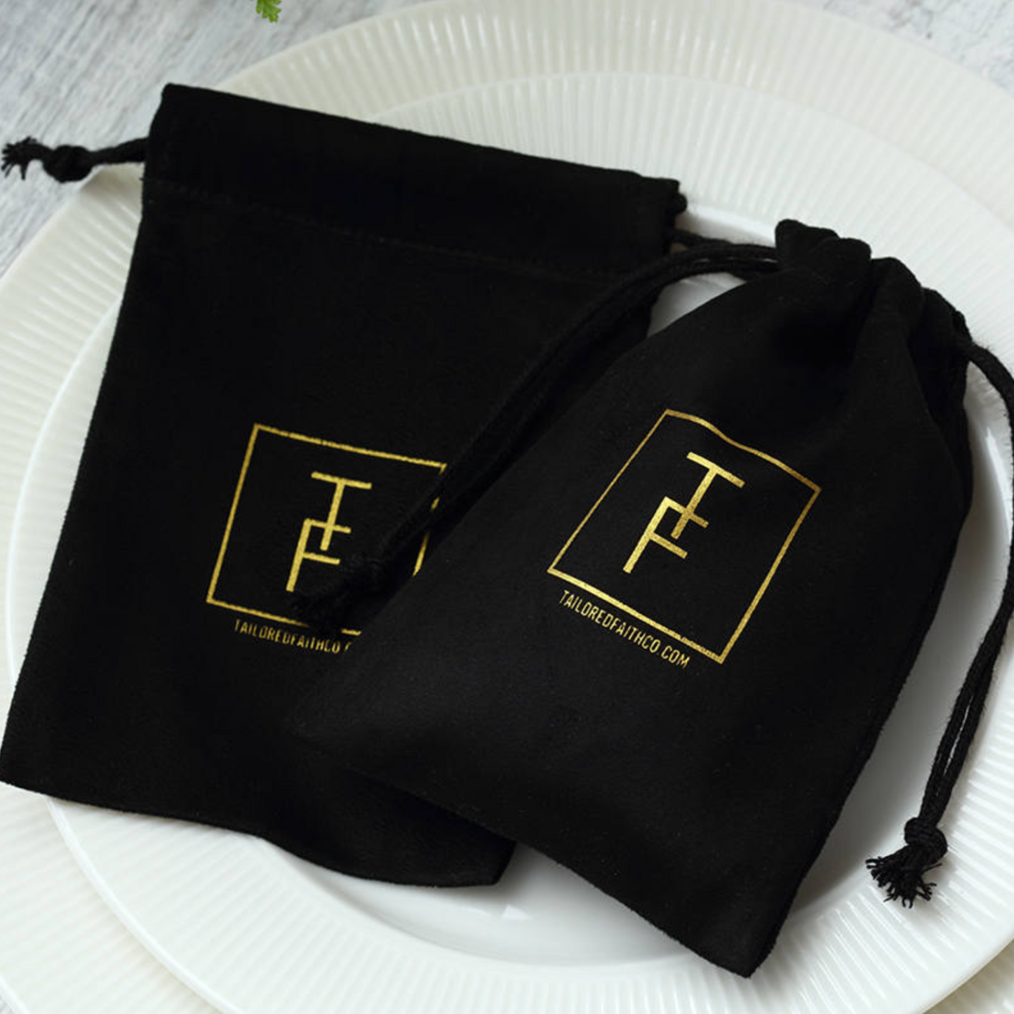 100 black pouches with custom design